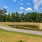 Walking trails around trees and lush landscaping
