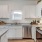 a kitchen with white cabinets