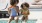 two young girls in a swimming pool