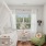 bedroom with bed green seat and window