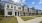 row of townhomes with walkways and grass