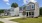 a row of homes with grass and driveways