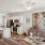 living room with wood flooring and view of the kitchen