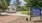 a park with a sign and gazebo