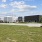a few buildings with grass and trees