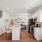 a large kitchen with wood flooring