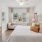 bedroom with bed dresser and large window