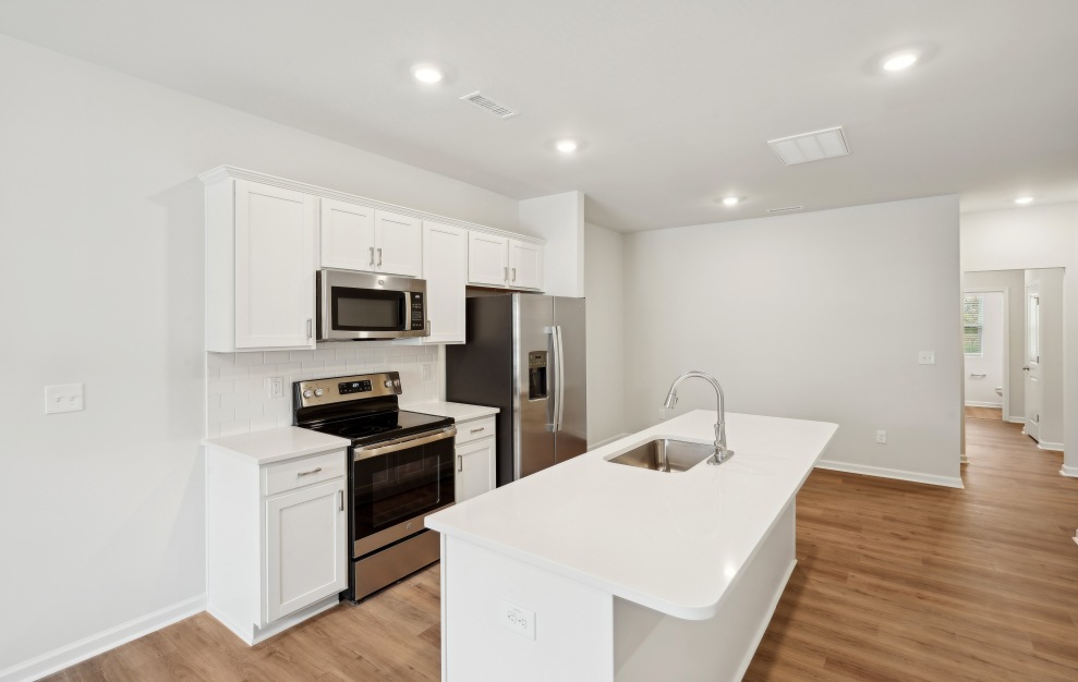 Kitchen with White Shaker Cabinetry and Stainless Steel Appliances