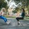 two women talking sitting on some swings