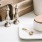 a kitchen counter with a plate cutting board and various kitchen items